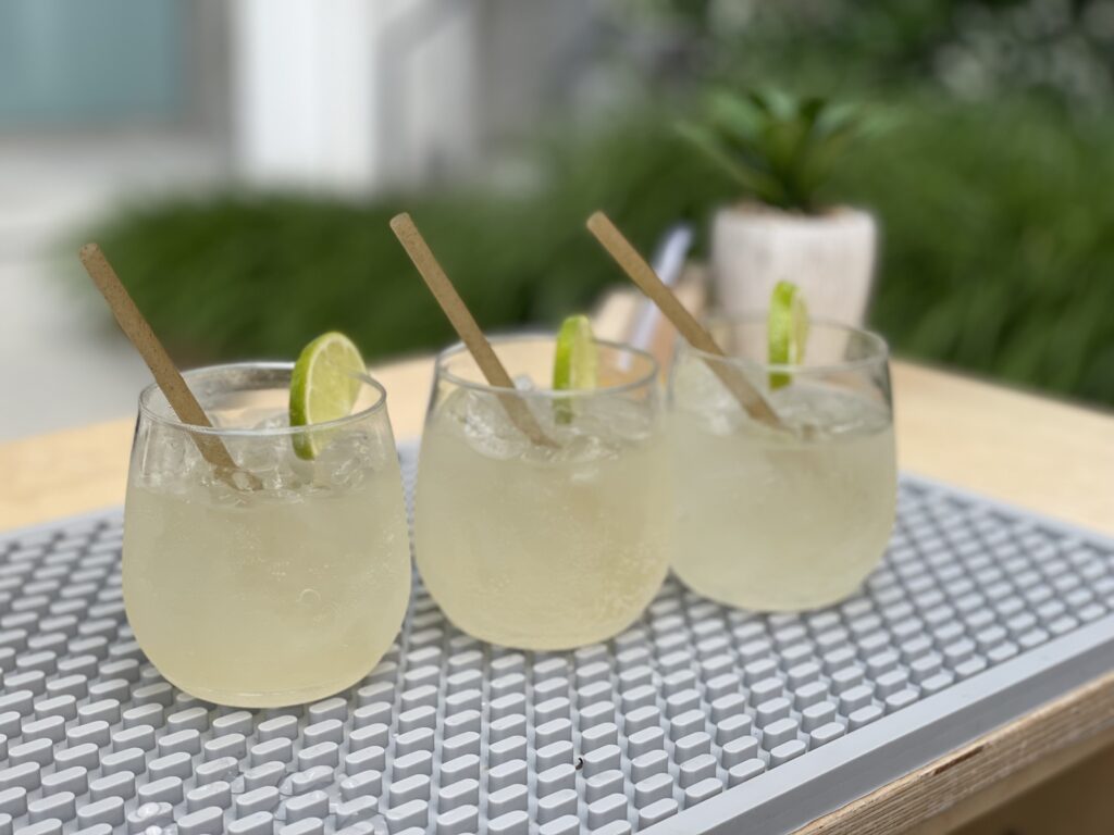 Three cocktails on the bartop at an office party in Portland, OR